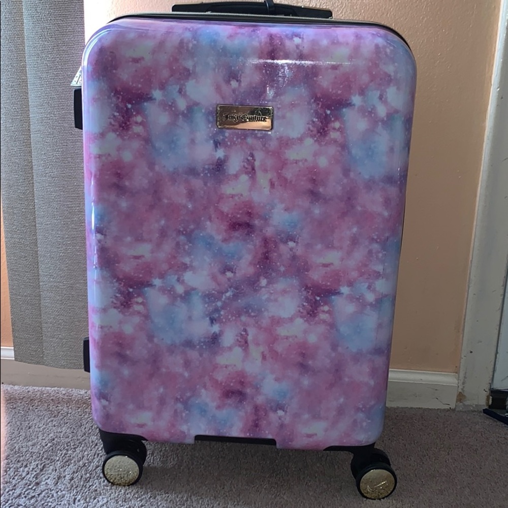 This is a medium sized juicy couture suit case